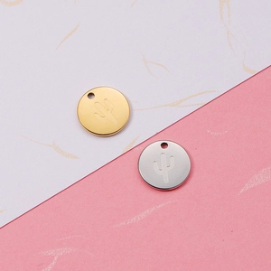 Detail of round cactus pendants in gold and silver finish for DIY jewelry making