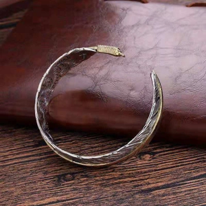 Vintage adjustable alloy feather cuff bracelet in silver and gold duo-tone finish