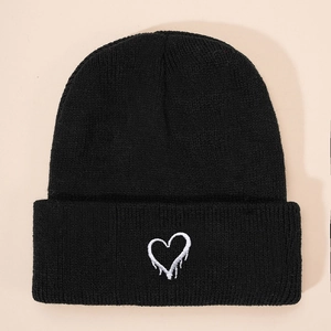 Black ribbed knit beanie with white dripping heart embroidery for kids winter casual wear