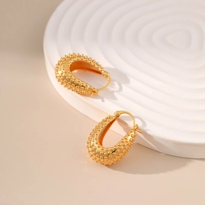 Elegant 18K gold plated U-shaped earrings with textured diamond pattern bead finish