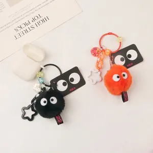 Plush coal elf keychain charms in black and orange with star and bead accessories