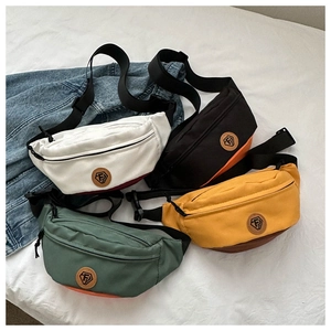 Flat lay view of durable oxford fabric waist bags in four colorways with FS logo