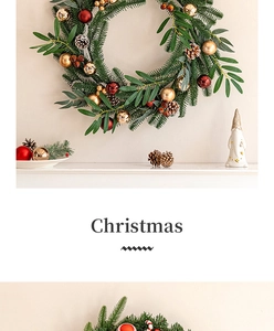 Christmas wreath with pine needles and gold ornaments hanging on a wall for festive decor