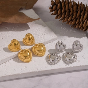 Elegant heart earrings with gold and silver finishes and textured braided rope edges