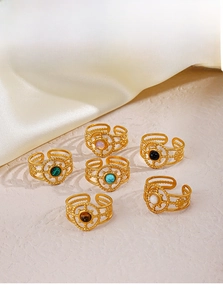 Set of six adjustable gold stainless steel rings featuring colorful inlaid gemstones