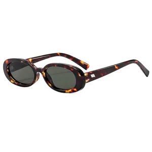 Retro oval tortoiseshell sunglasses with dark lenses and gold metal accents on arms
