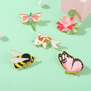 Chinese style enamel brooches featuring dragonfly, lotus, koi, bee, and butterfly designs