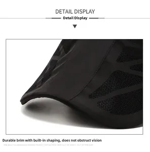 Detail of a durable black baseball cap brim featuring mesh texture and sturdy sandwich layers