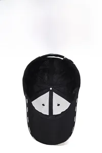 Close-up of black baseball cap with breathable mesh lining and fashion lettering on the brim