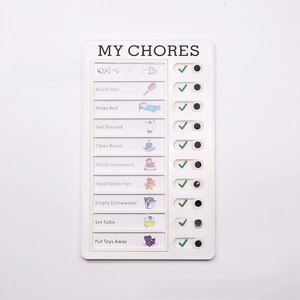 Detail of MY CHORES memo checklist board with sliding buttons and daily task icons