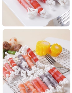 Close-up of realistic artificial beef rolls with enoki mushrooms and BBQ prop models