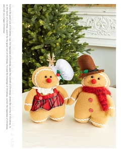Detail of plush gingerbread man and woman dolls in a festive warm Christmas scene