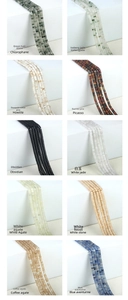 Macro display of 2x4mm flat natural stone beads including agate and obsidian for DIY jewelry