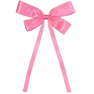 Detail of pink satin ribbon hair bow hairclip with long tails and elegant silky texture