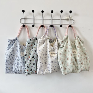 Collection of four patterned canvas tote bags with various cute cartoon prints
