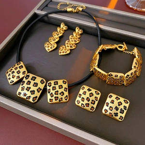 Detailed jewelry set view featuring leopard print flower and heart necklace with earrings