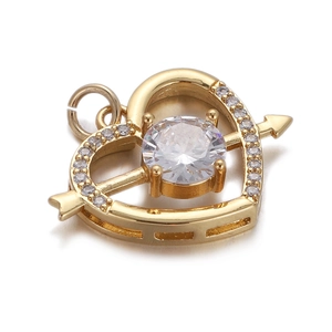 Macro shot of gold-plated heart-shaped pendant with cubic zirconia for bracelets