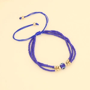 Bohemian evil eye beaded bracelet with three-layer blue beads and gold accents