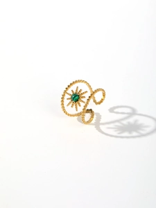 Detail of 18k gold plated stainless steel ring featuring malachite stone and sunburst motif