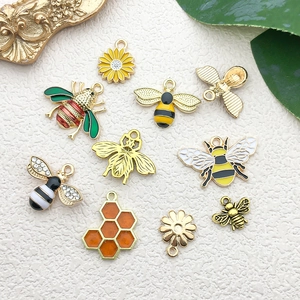 Detailed collection of yellow enamel bee and sunflower alloy charms for DIY jewelry making