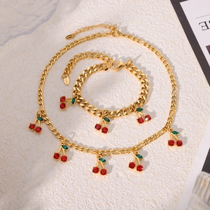 Chic gold chain necklace and bracelet set with sparkling red cherry pendants for women