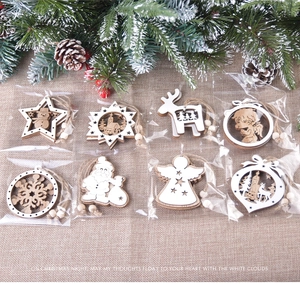 Various wooden hollow Christmas ornaments with jute string and beads on rustic background