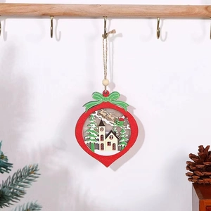 Detail of a red wooden teardrop ornament with multi-layer laser cut Christmas scenes