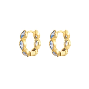 Detail of gold hoop earrings featuring multi-claw set light blue crystals on white background