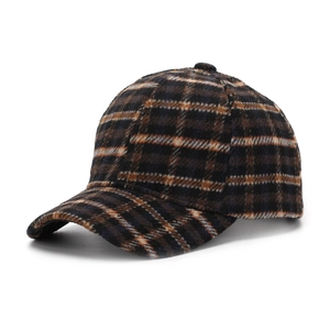 Detailed close-up of brown houndstooth pattern fabric on a baseball cap with stitching