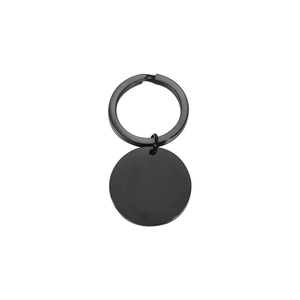 Detail of a minimalist black metal round tag keychain with a polished smooth finish