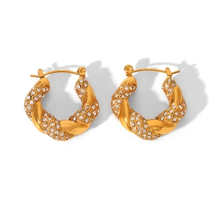 Detailed view of gold twisted hoop earrings with pave-set shimmering crystals