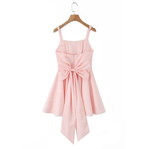 Pink A-line mini dress with a large bow decoration on the back view and thin straps