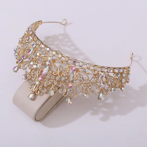 Detailed close-up of golden bridal crown featuring intricate metalwork and colorful rhinestones