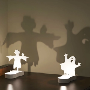 Halloween scarecrow and ghost silhouette projection lamp with white light base on wood