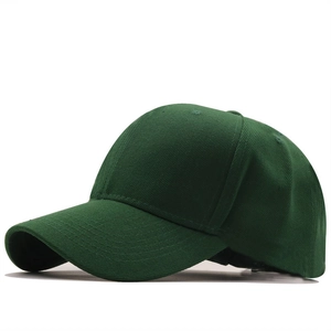 Detail of dark green cotton twill baseball cap showing side eyelets and fabric texture