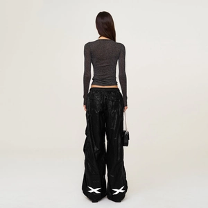 Detailed back view of a slim-fit dark gray shimmer knit top with white cross print pants