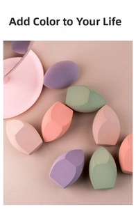 Macro detail of soft multi-colored makeup sponges with slanted edges in pastel tones