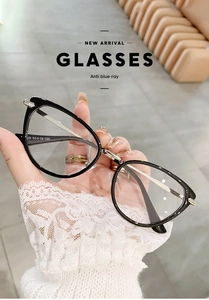 Close-up of stylish black oversized cat-eye glasses with anti-blue light protection