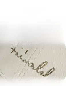 Detailed embroidery on a beige cotton baseball cap with stylish cursive lettering