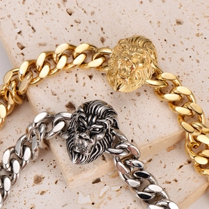 Mens stainless steel cuban link bracelet with gold and silver lion head design