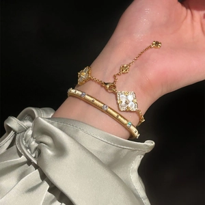 Elegant gold plated brushed bangle and clover charm bracelet set with zircon for women