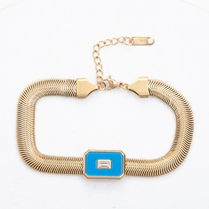 Detailed view of gold stainless steel snake chain bracelet with blue enamel inlay