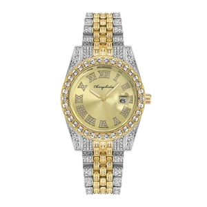 Luxury women's quartz watch with two-tone diamond bezel and gold dial with date