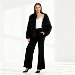 Faux fur shaggy jacket in black with round neck and short cut over a white top