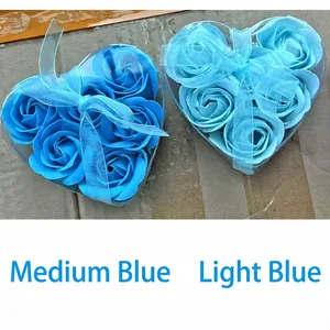 Gift set with two heart-shaped boxes of soap roses in light and medium blue with ribbons