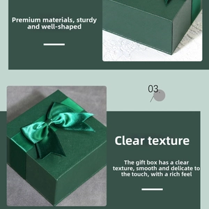 Detail of dark green textured cardboard jewelry box with satin ribbon bow decoration