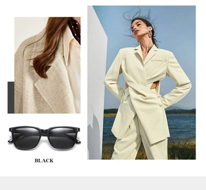 Detailed view of black square frame sunglasses with metal rivet accents on classic temples