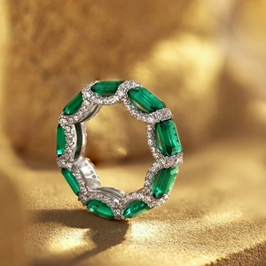 Detailed close-up of S925 sterling silver stamp on vintage emerald cut green zircon ring