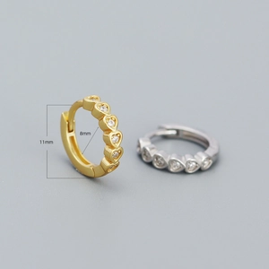 Sparkling heart shaped hoop earrings with clear zircon stones in gold and silver finish