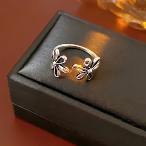 Vintage hollow flower open ring in distressed silver finish on premium jewelry box